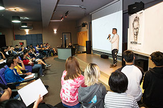 Low during his talk at The One Academy – When he was younger, his friends would be out partying and hanging out after hours while he was stuck at work, working very hard.