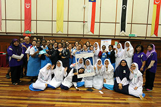 Last year’s participants having a group photo with their teachers after the end of the competition.