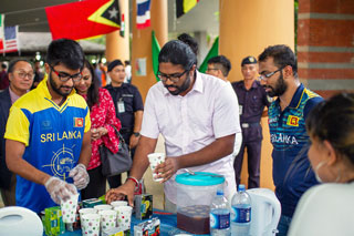 Sri Lankan students serving their country’s famed tea.