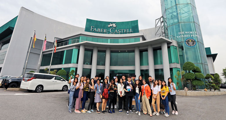A group photo of The One Academy’s students and lecturers with the World’s Tallest Pencil encased in the glass tower at Faber-Castell Malaysia.