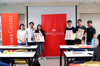 The three winners of the Faber-Castell Mini Sleeve Eraser Packaging Design Competition holding their winning designs. The winners are (from left): Sylvia Oi Sze-Wei (3rd Prize), Chuan Yu Ming (Grand Prize) and Goh Jia Hern (2nd Prize). Standing on far left is Debbie Chin Cher Wei, Deputy Head of Advertising & Graphic Design at The One Academy.