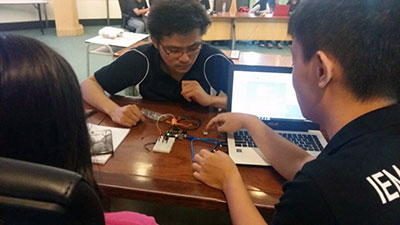 Students familiarising themselves with microcontroller kits