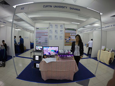 Chan at her project booth during the competition