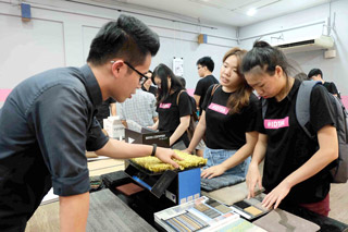 Interested students interacting with Goodrich Global’s personnel at the material exhibition.