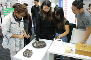 Students admiring the various package designs at the ASPaC exhibition.