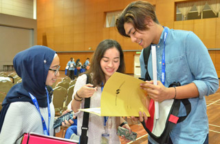 Asyiela Putri Azhar (in the middle) with Adam Muqrish Azlisham (right) are discussing on registration process witnessed by another student, Nuhasakinah Saiful Bahrin during new student intake at MMU, Cyberjaya, recently