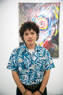 ‘Aiman Zamri with his painting ‘Colours We Sought’, at the G13 Gallery.