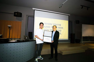 Jeremy is presented with a token of appreciation by Chan Kon Loong, Deputy Course Director of Advertising & Graphic Design.